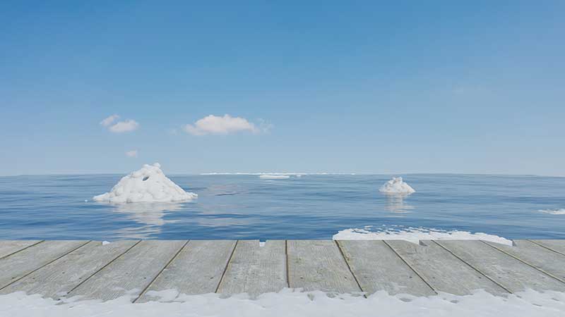 Blog Ambiental • Vista de pedaços de gelo flutuando em águas árticas, simbolizando o derretimento das calotas polares devido às mudanças climáticas.